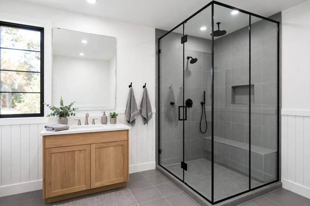 Bathtub with tiled surround and fixtures in a San Fernando bathroom remodel.